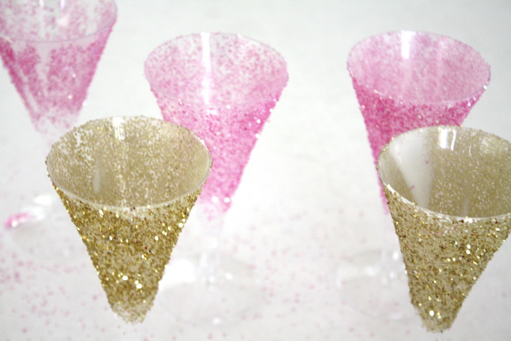 Add a little sparkle and glam to your party, wedding, or bridal shower with these Easy DIY Glitter Champagne Flutes via Sarah Sofia Productions