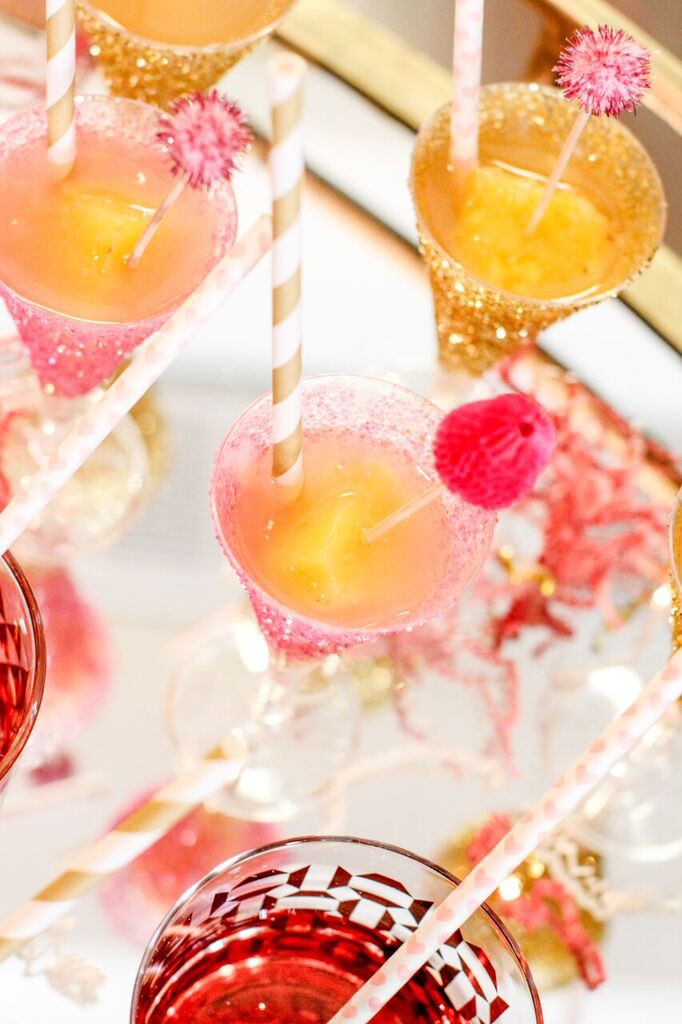 Add a little sparkle and glam to your party, wedding, or bridal shower with these Easy DIY Glitter Champagne Flutes via Sarah Sofia Productions